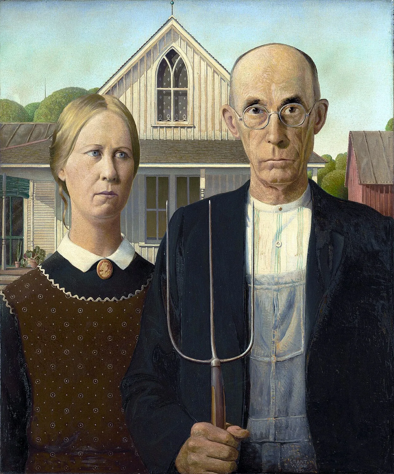 American Gothic (1930) by Grant Wood showing a stern-faced farmer holding a pitchfork and a younger woman standing before a white Carpenter Gothic house in Iowa