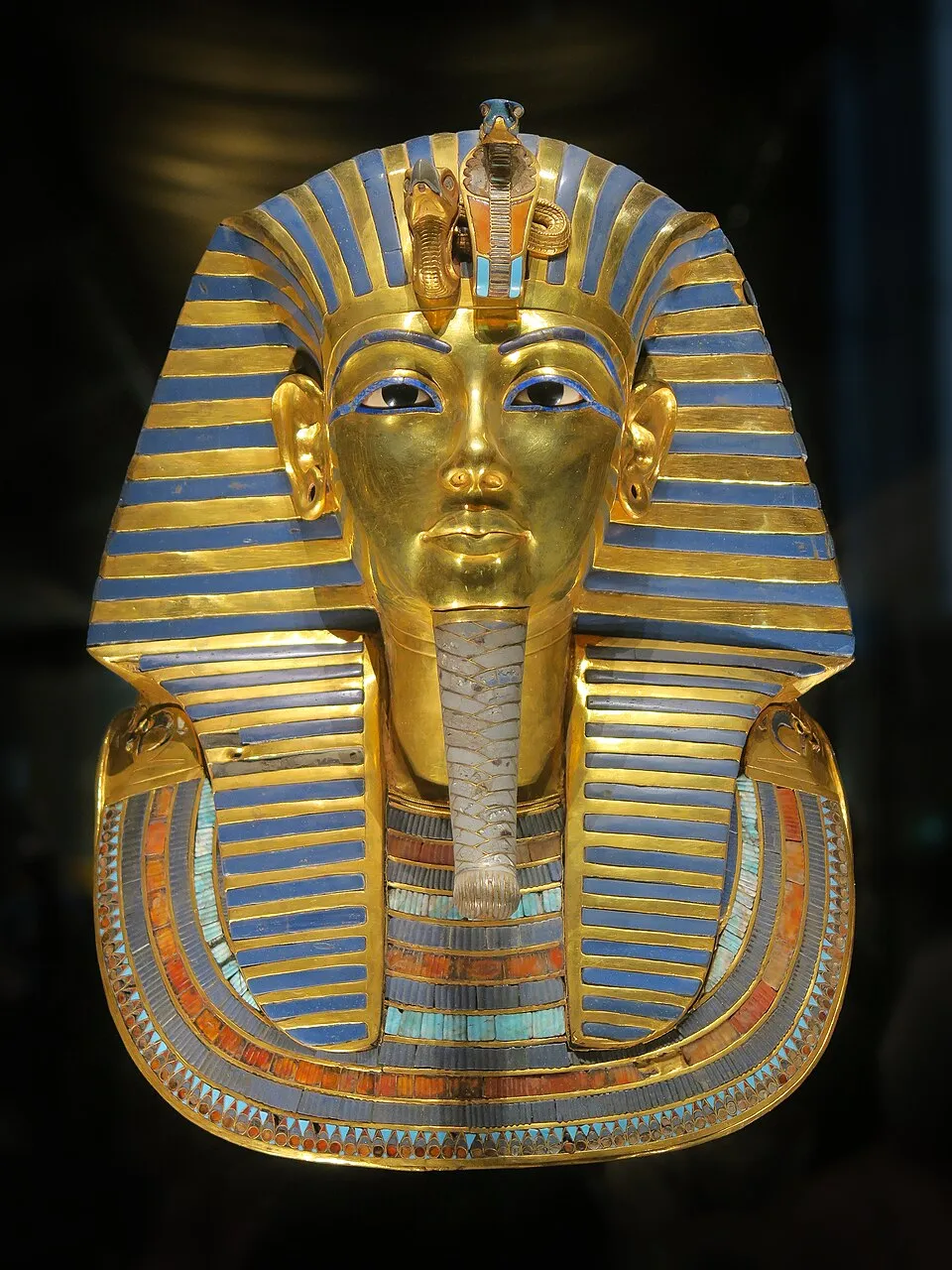 The golden death mask of Tutankhamun, c. 1323 BC, gold inlaid with lapis lazuli, turquoise, and carnelian. Egyptian Museum, Cairo