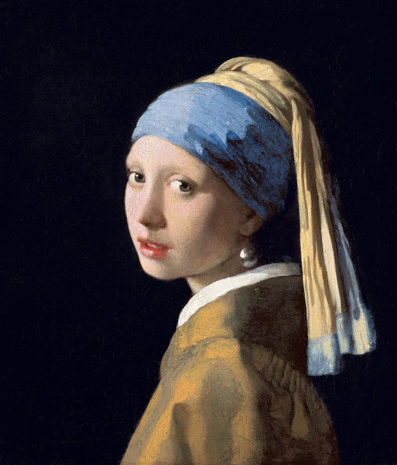 Girl with a Pearl Earring (c.1665) by Vermeer showing the iconic lighting effect that has influenced cinematographers for decades: a single soft light source against a dark background creating an intimate quality of attention