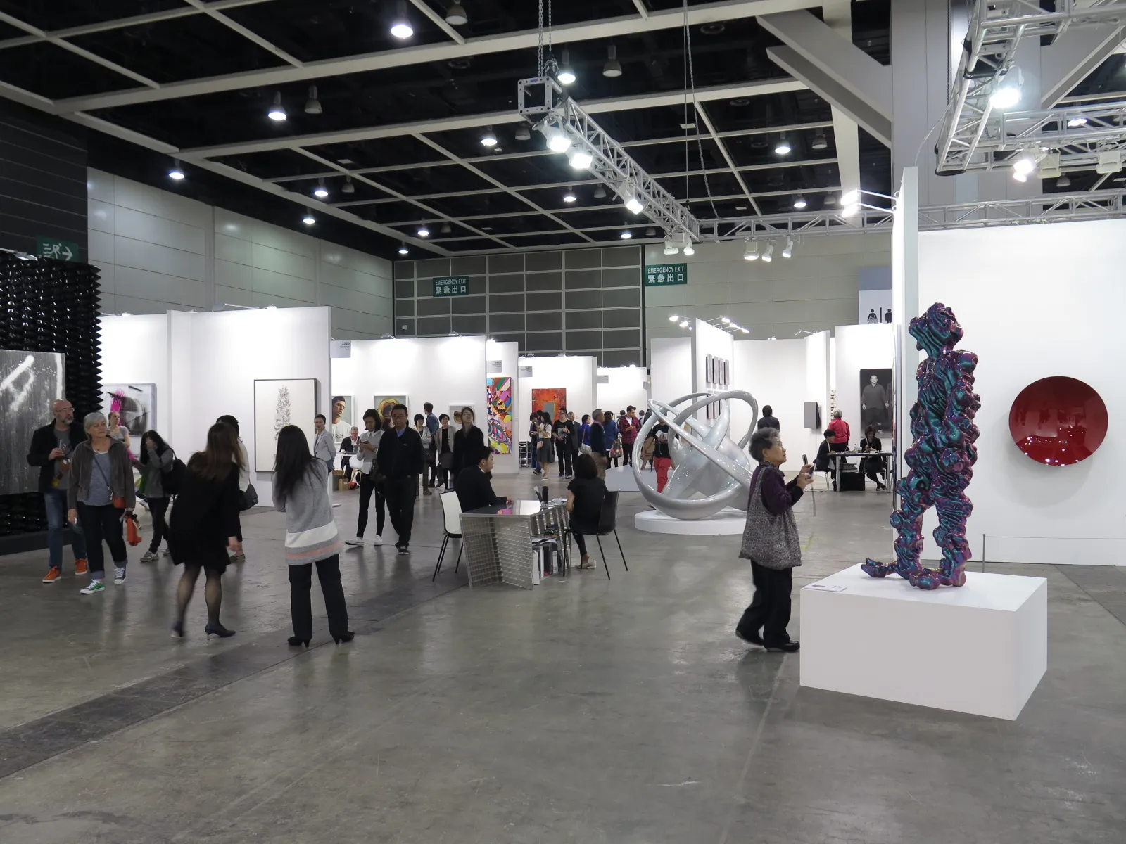 Interior of Art Basel Hong Kong 2015 at the Hong Kong Convention and Exhibition Centre, showing gallery booths and visitors