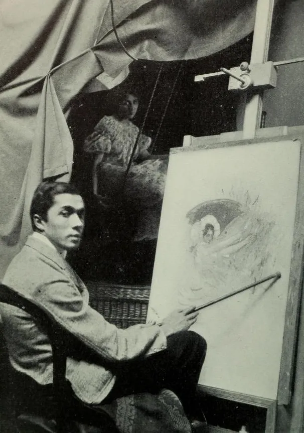 Black and white photograph of artist Frank Xavier Leyendecker working in his studio on a painting, representing the self-directed practice of a professional artist