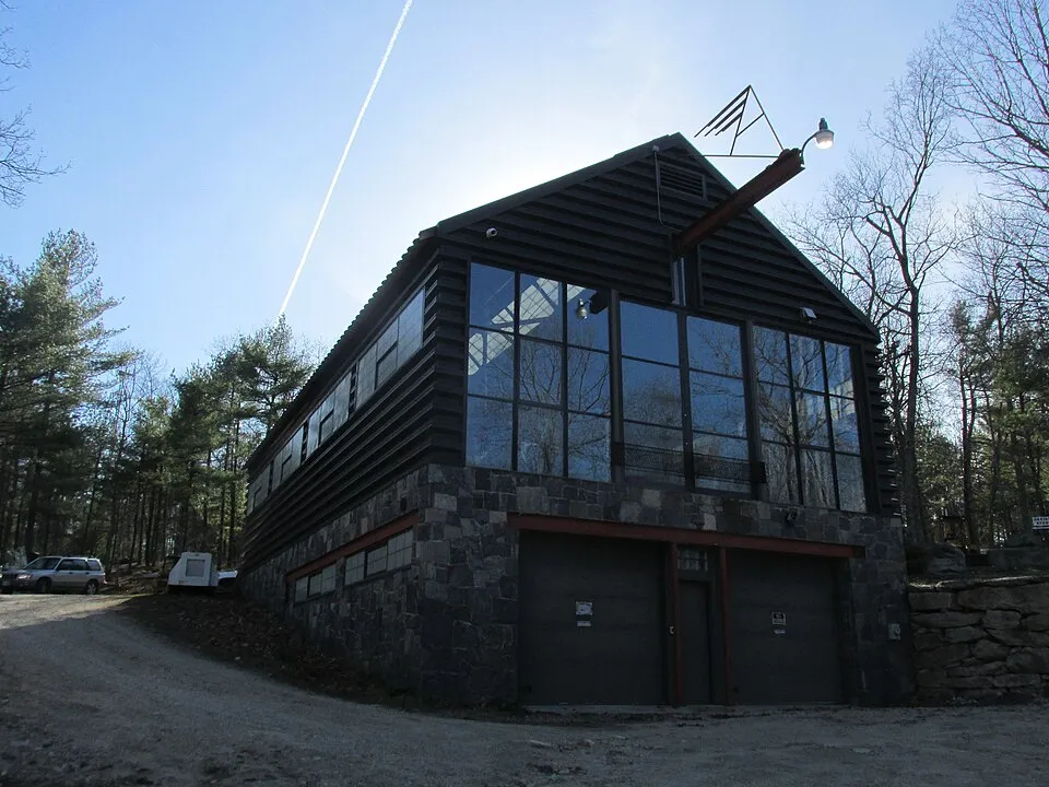 An artist's studio at the Andres Institute of Art in New Hampshire, showing a workspace surrounded by natural landscape
