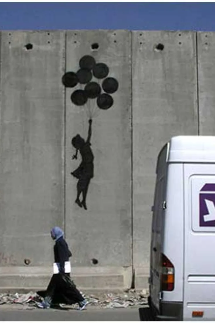 Banksy artwork on the Israeli West Bank barrier wall in Bethlehem showing a girl being lifted by balloons