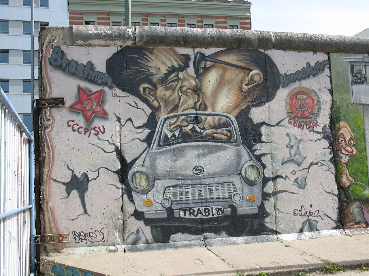 The famous mural at the East Side Gallery showing the fraternal kiss between Soviet leader Leonid Brezhnev and East German leader Erich Honecker, painted by Dmitri Vrubel in 1990, one of the most iconic images of the Berlin Wall and a satirical commentary on Cold War politics