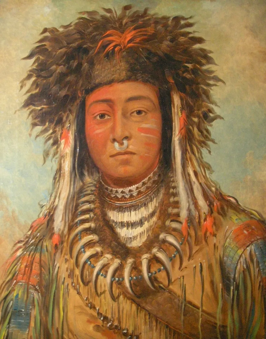 An Aboriginal Australian person with ceremonial body painting using red and white ochre, showing geometric patterns on the chest and arms, demonstrating one of the oldest continuing art traditions in the world