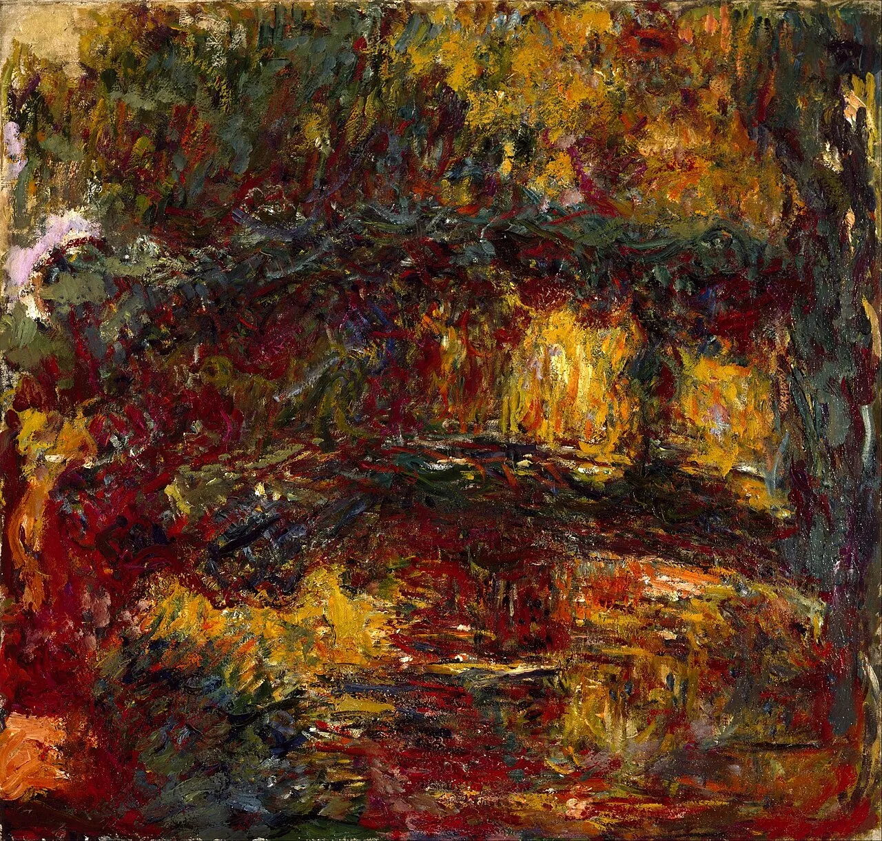 The Japanese Footbridge (1899) by Claude Monet showing the green arched bridge over the lily pond at Giverny surrounded by weeping willows and water plants