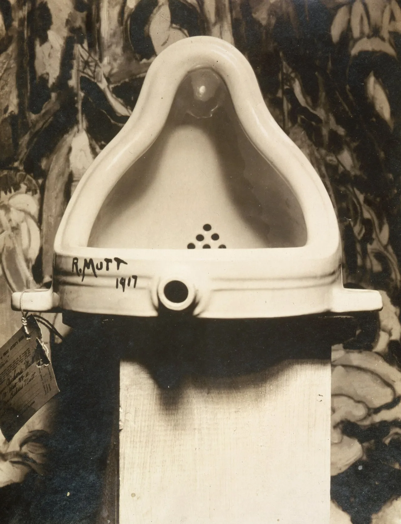 Marcel Duchamp's Fountain (1917) photographed by Alfred Stieglitz, showing a porcelain urinal displayed as a work of art with R.Mutt 1917 written on the side