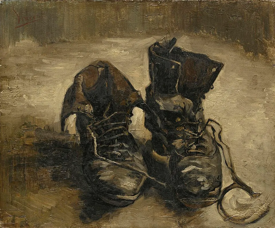 Vincent van Gogh, A Pair of Shoes (1886). A worn pair of peasant shoes, weathered and battered, sitting on a dark surface