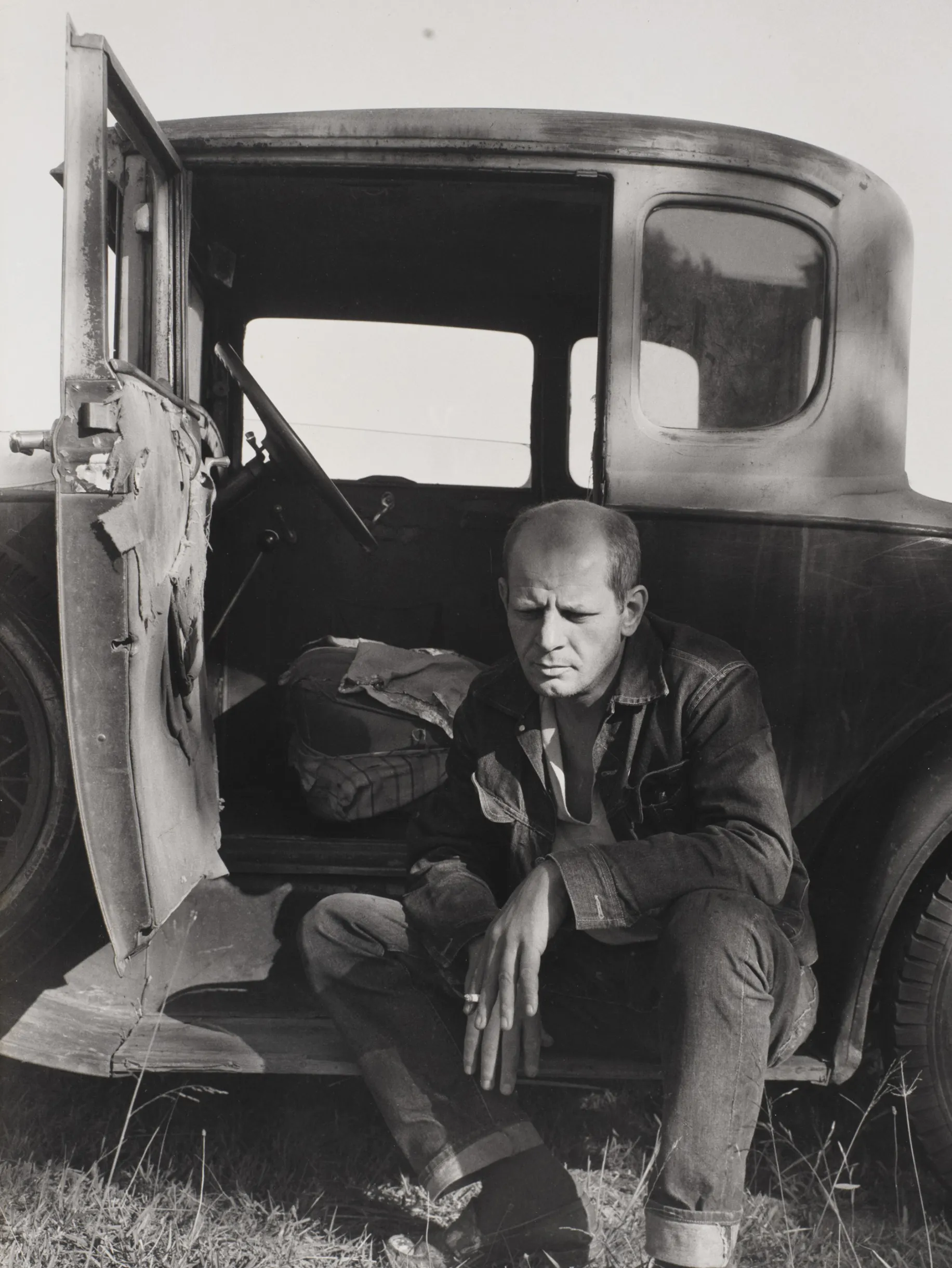 Jackson Pollock photographed by Hans Namuth in 1951, shown painting on a large canvas on the floor of his studio, demonstrating his drip painting technique