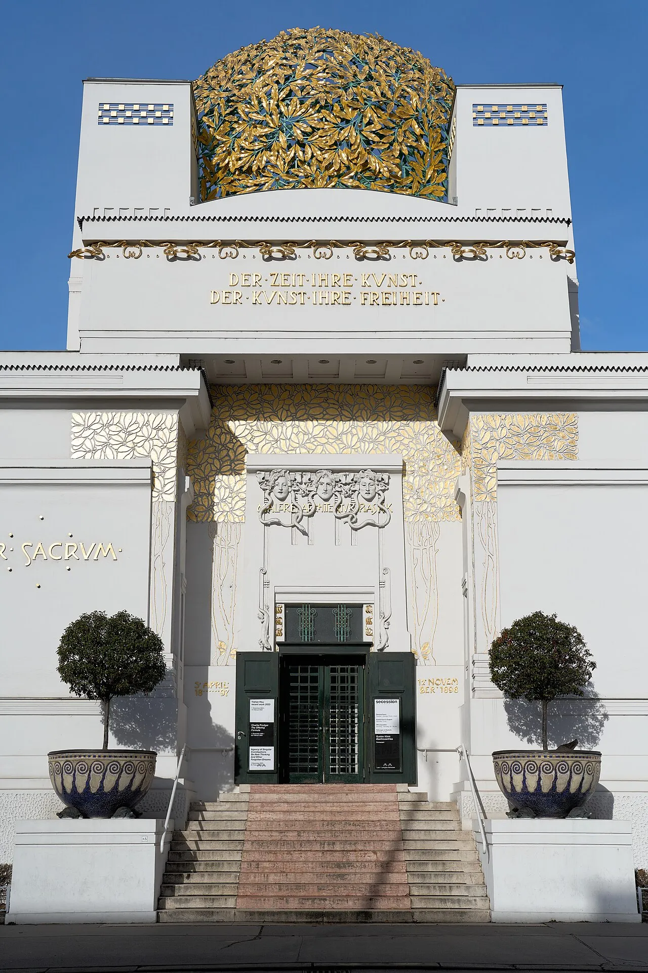 The Vienna Secession building designed by Joseph Maria Olbrich showing the characteristic golden dome of laurel leaves above the white cube of the exhibition hall with the inscription on the facade