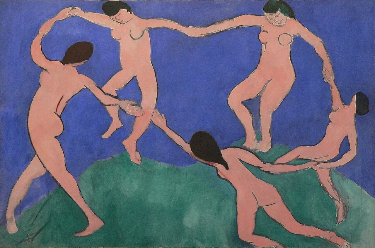 The Dance I (1909) by Henri Matisse showing five figures in a circle holding hands and dancing against a simple background of blue sky and green ground, painted in vivid pink-red against flat color fields