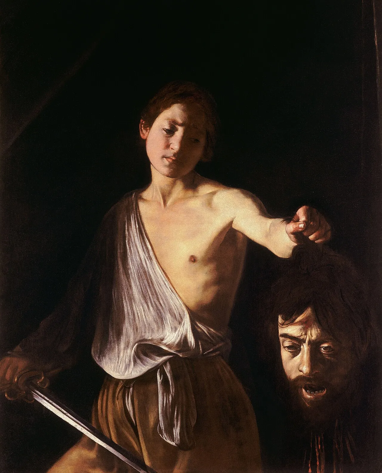David with the Head of Goliath, a painting by the Italian Baroque master Caravaggio, c. 1610, showing chiaroscuro lighting