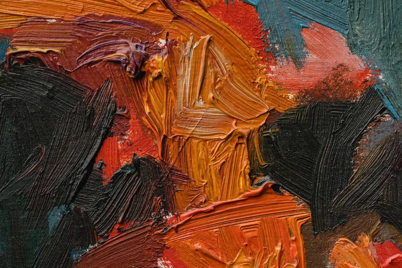 A macro close-up of thick impasto oil paint showing visible ridges and gestural brushwork