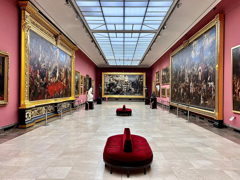 A museum gallery interior with paintings on the walls and visitors walking through, the environment where museum apps and audio guides enhance the experience, providing context, stories, and navigation without the need to read every wall label
