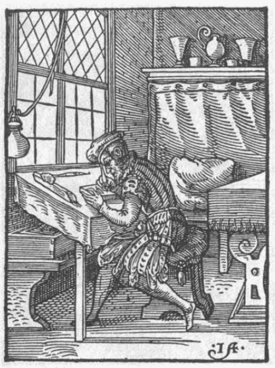 16th-century woodcut showing a printer's workshop with woodblock cutting and press operation