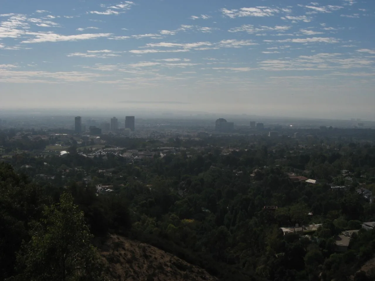 A panoramic view from the Getty Center in Los Angeles looking south past Santa Monica to the Palos Verdes Peninsula, showing the kind of sweeping cityscape view that defines the relationship between art institutions and the cities they inhabit, a contrast to New York's dense urban museum landscape