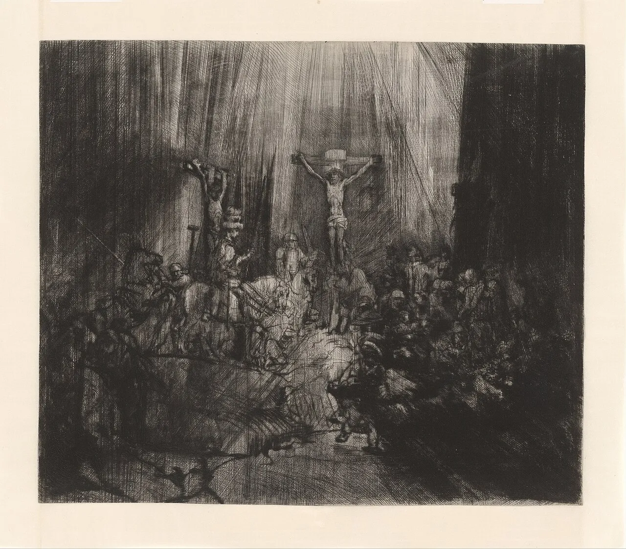 The Three Crosses by Rembrandt, a dramatic etching with drypoint showing the crucifixion with intense light and shadow