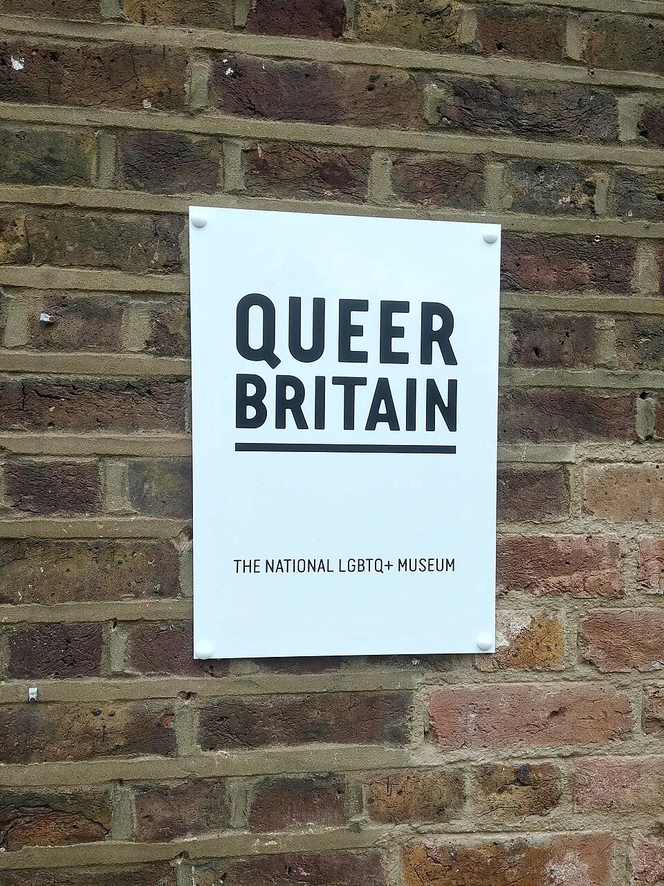Queer Britain museum entrance sign in King's Cross, London, the UK's first national LGBTQ+ museum, which hosts the annual Queer Britain Art Award celebrating Queer Creativity across generations