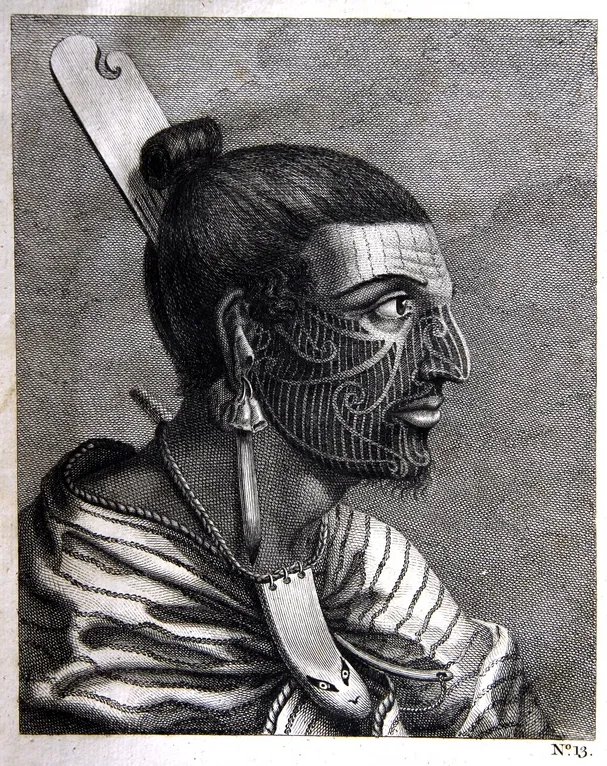 A Māori chief with traditional facial ta moko tattoos, showing elaborate curvilinear patterns that record genealogy, rank, and personal history, demonstrating the sophisticated tattoo tradition of New Zealand