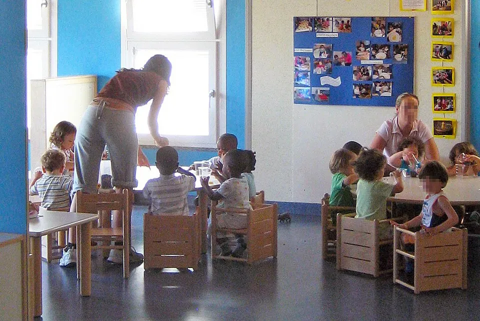 A Reggio Emilia-inspired atelier (art studio) for children, filled with natural materials, tools, and works-in-progress, demonstrating the Reggio approach where art is not a subject but a vehicle for learning and the environment is the third teacher