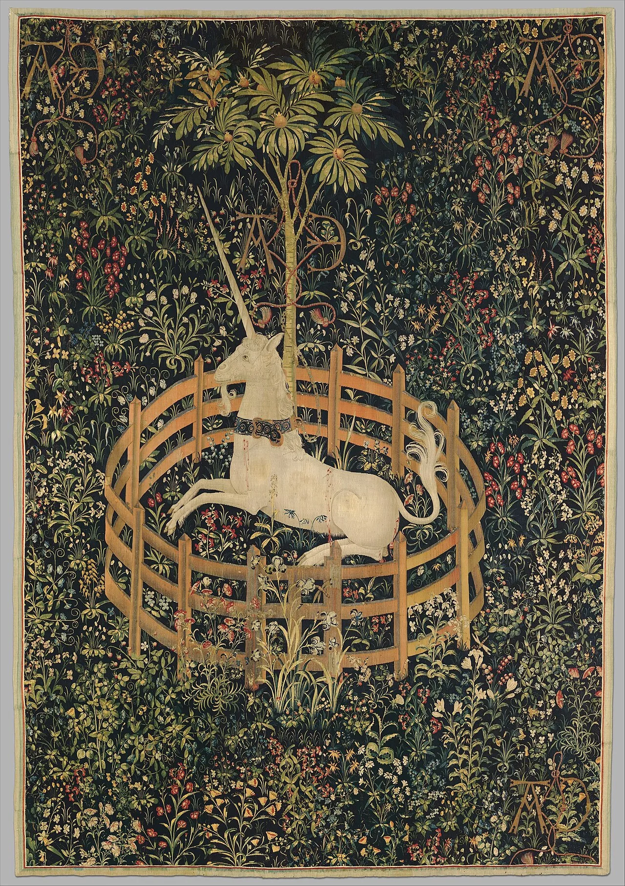 The Unicorn in Captivity (c.1495-1505), the final panel of the Unicorn Tapestry series at the Cloisters, New York, showing the iconic white unicorn enclosed in a wooden pen against a millefleurs background