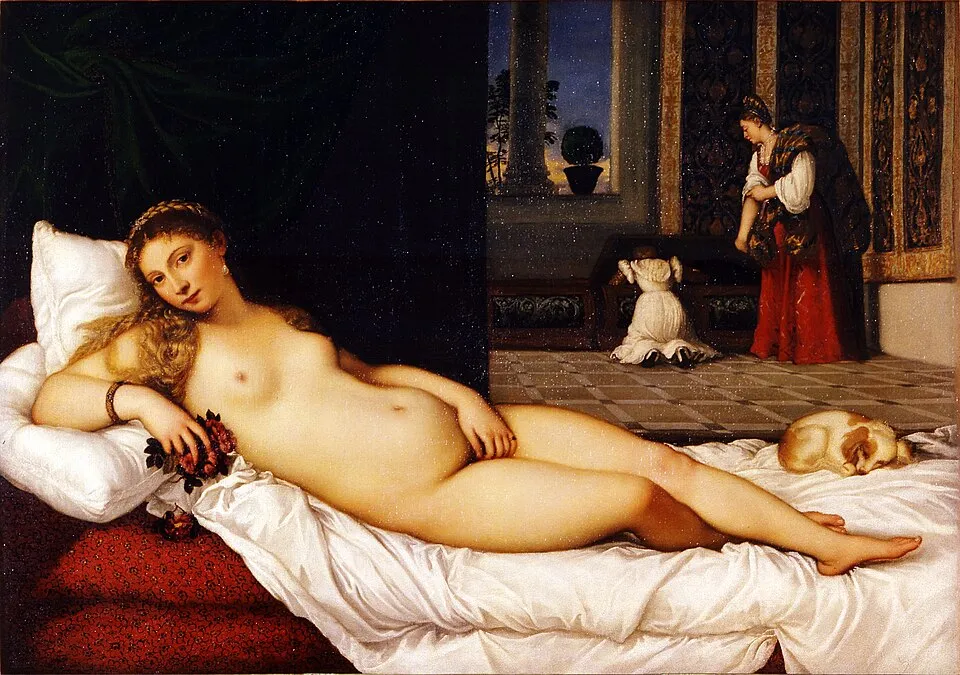 Titian, Venus of Urbino (1538). A reclining nude woman on a bed, looking directly at the viewer, with servants in the background, set in a domestic interior rather than a mythological landscape