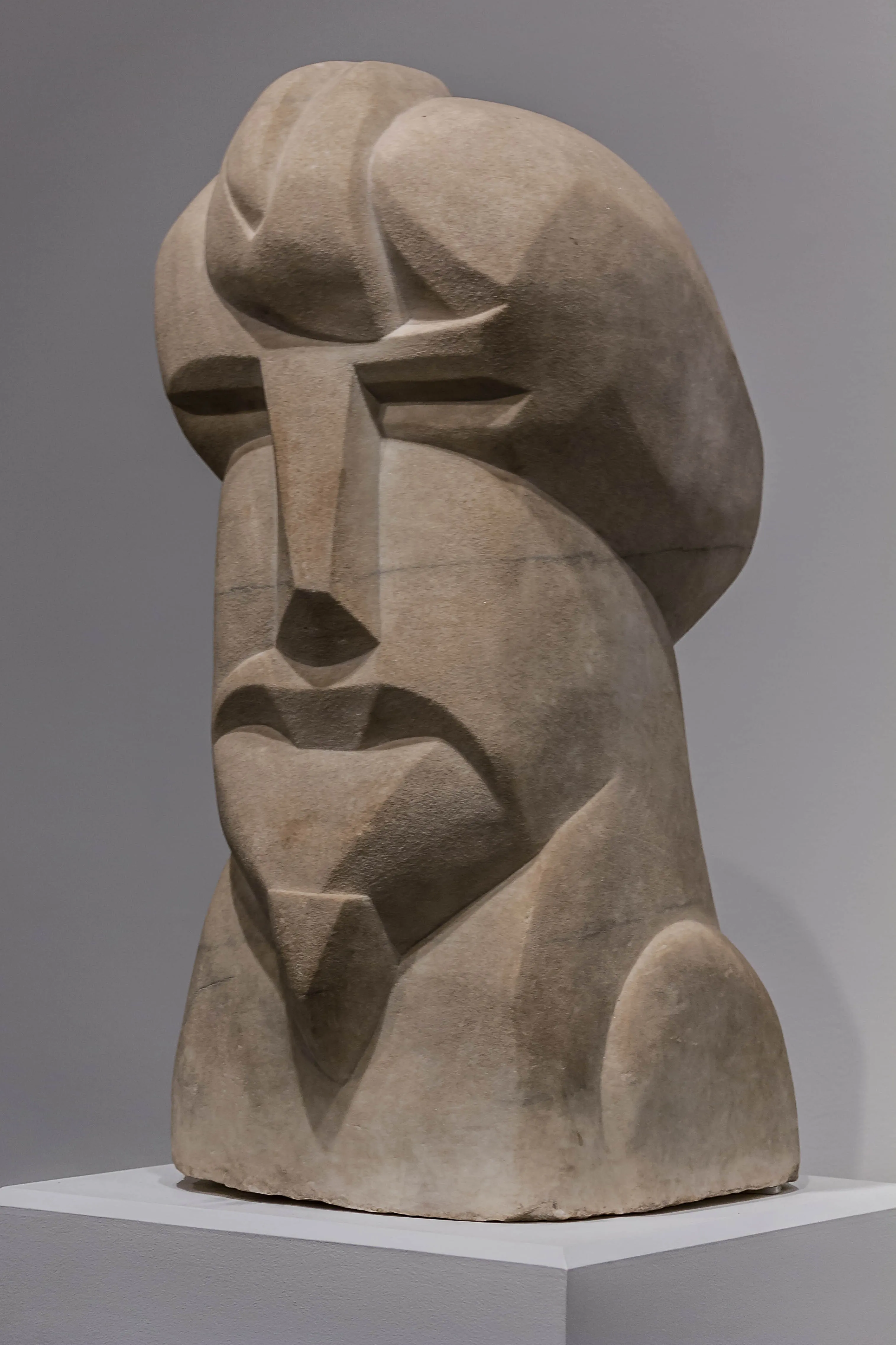 Henri Gaudier-Brzeska, Hieratic Head of Ezra Pound, 1914. A carved stone head showing the poet's features in a stylized, angular form influenced by non-Western sculpture.