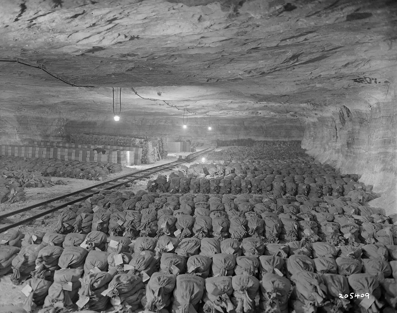 Allied soldiers examining artworks stored in the Merkers salt mine, Germany, April 1945, where thousands of artworks looted by the Nazi regime were discovered hidden